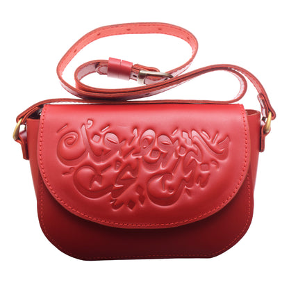 Genuine leather shoulder bag with an ornate design