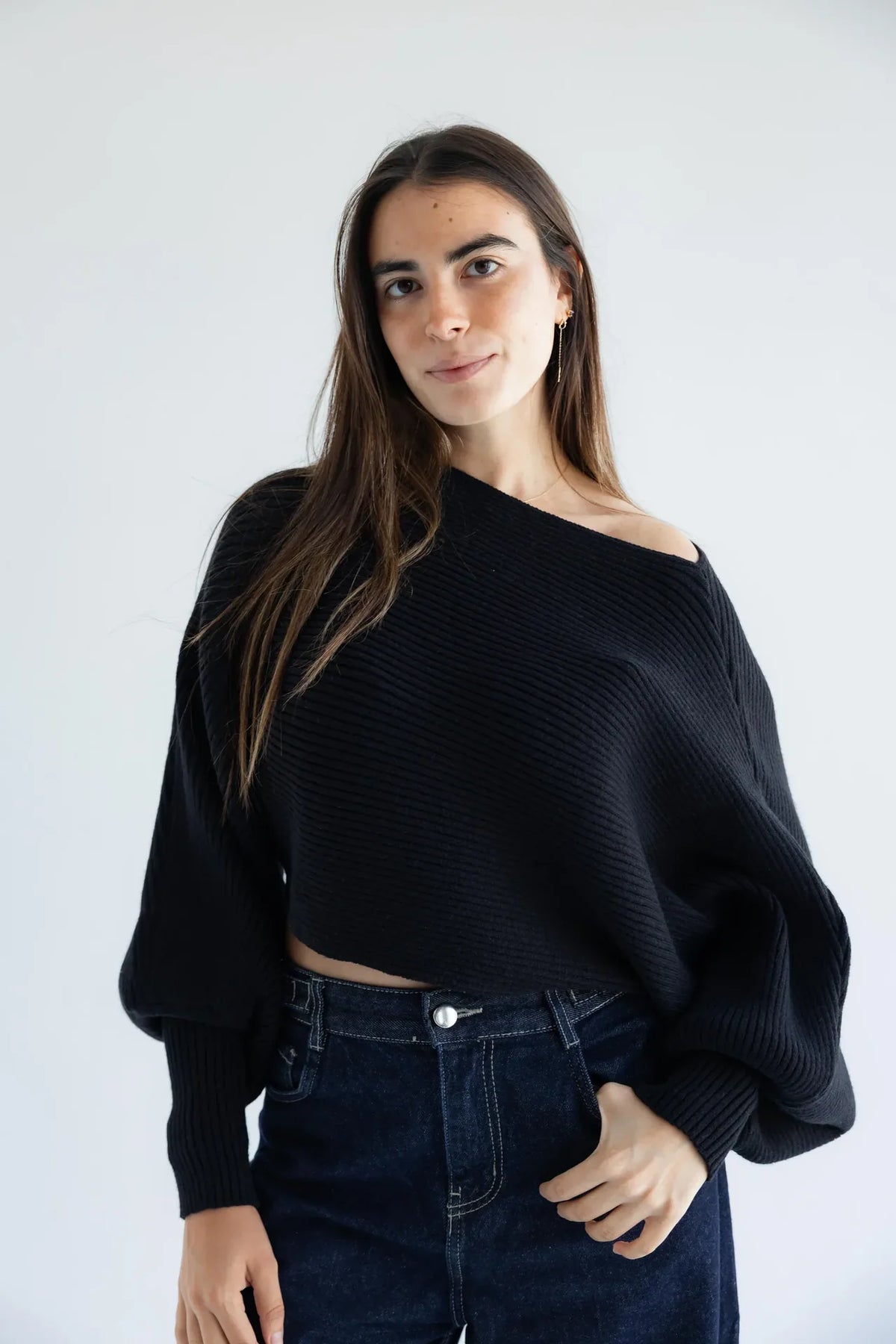 Women's black off-shoulder ribbed knit pullover - front view