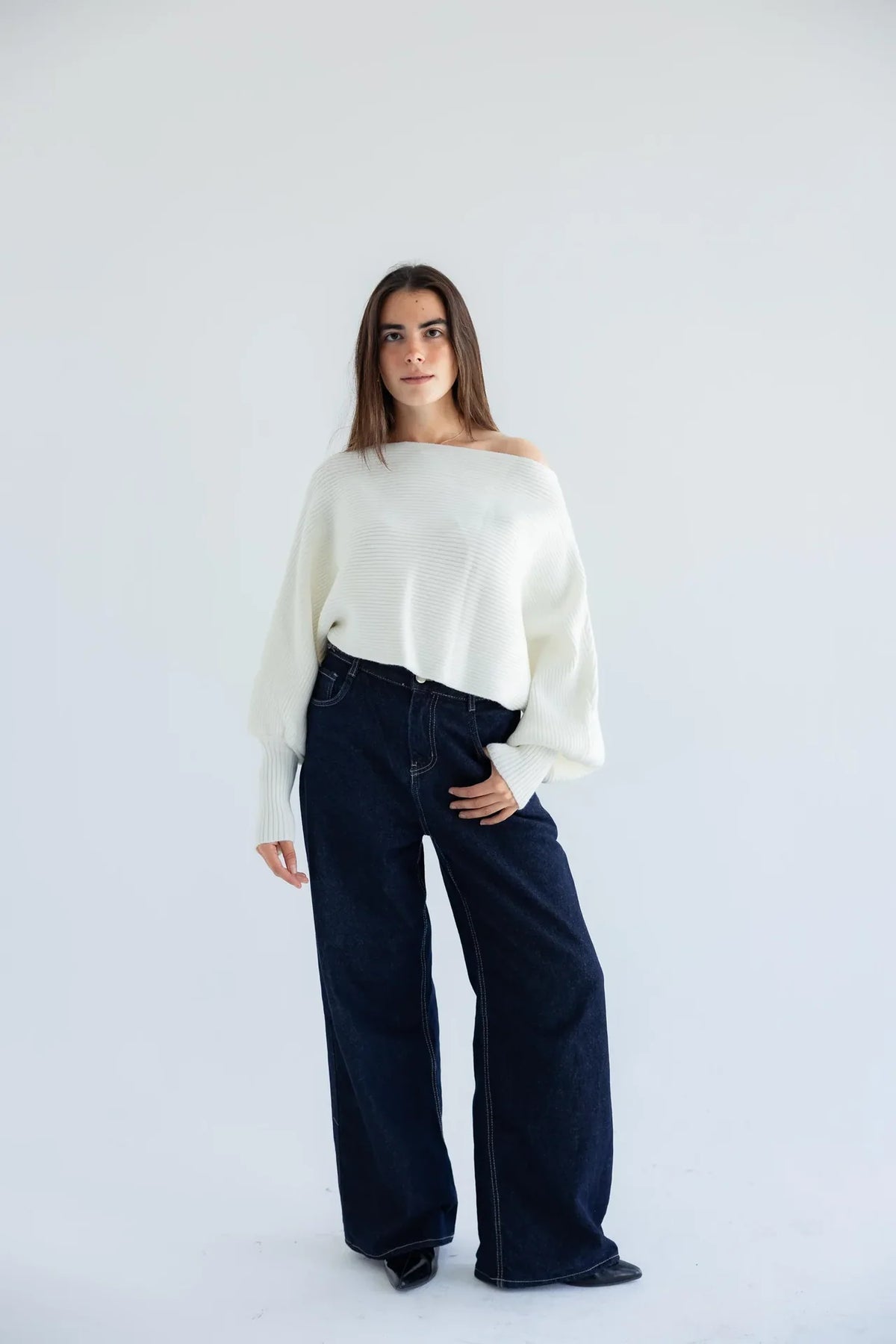 Ivory off-shoulder pullover with dark wide-leg jeans - full length