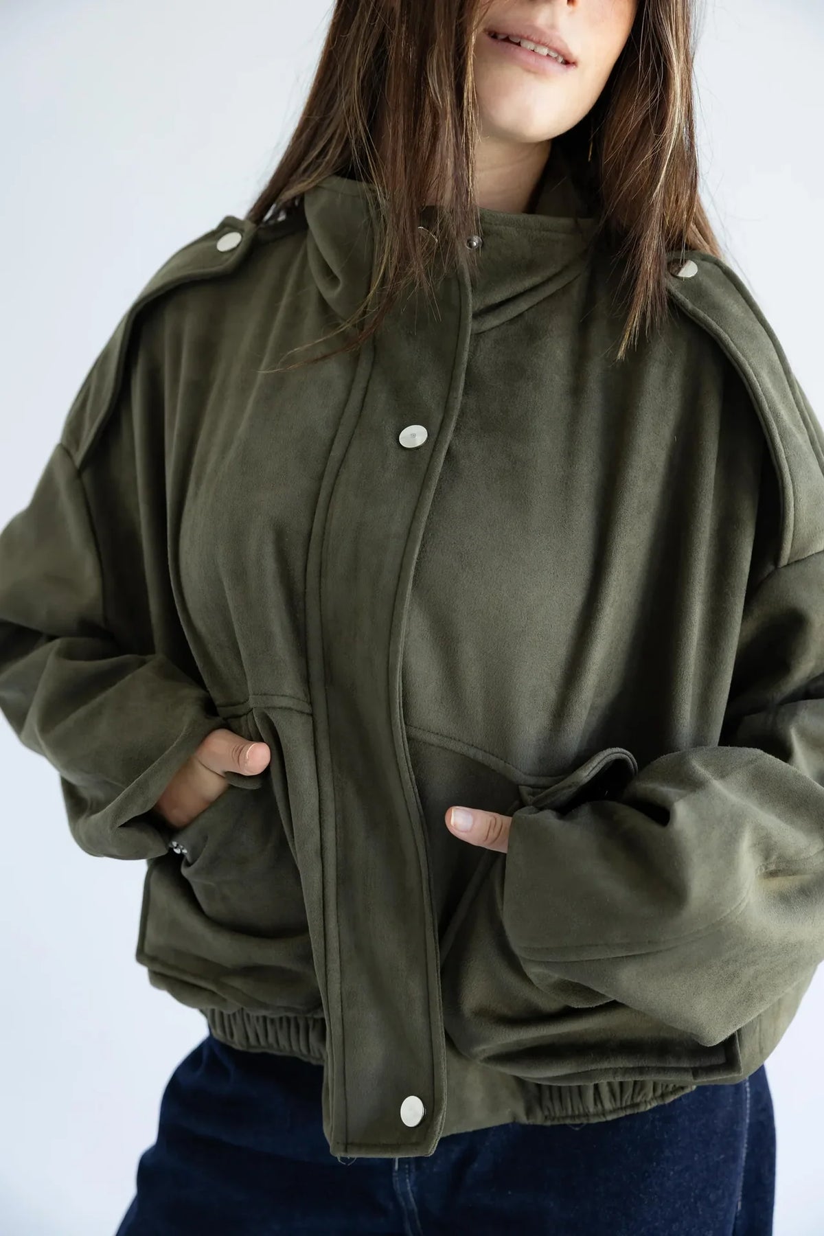 Close-up of epaulettes, snap placket and flap pockets