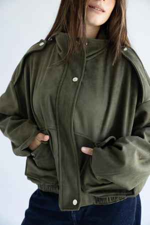 Close-up of epaulettes, snap placket and flap pockets